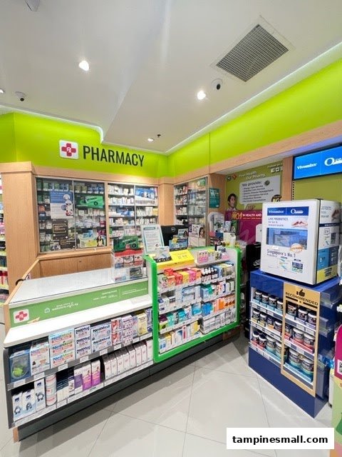 Interior view of Watsons pharmacy, showcasing a well-stocked counter and shelves with health and wellness products.
