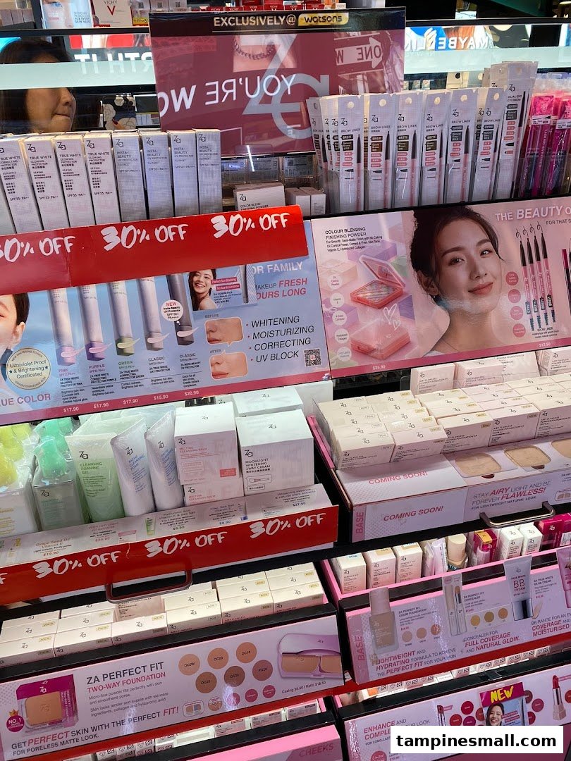 A vibrant display of Za beauty products, including foundations and skincare, with prominent '30% OFF' promotions.