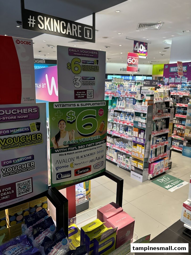 Interior view of a Watsons pharmacy, showcasing health, beauty, and supplement products with promotional displays.