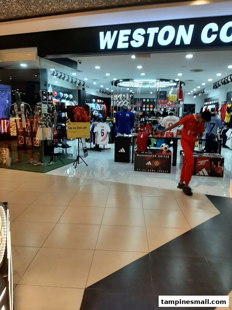The shop front of Weston Corp, a sports apparel store, showcasing jerseys and sports merchandise.