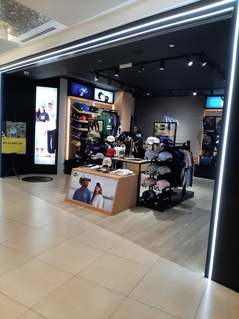 Brightly lit entrance of Weston Corp, a retail store showcasing hats, apparel, and accessories.