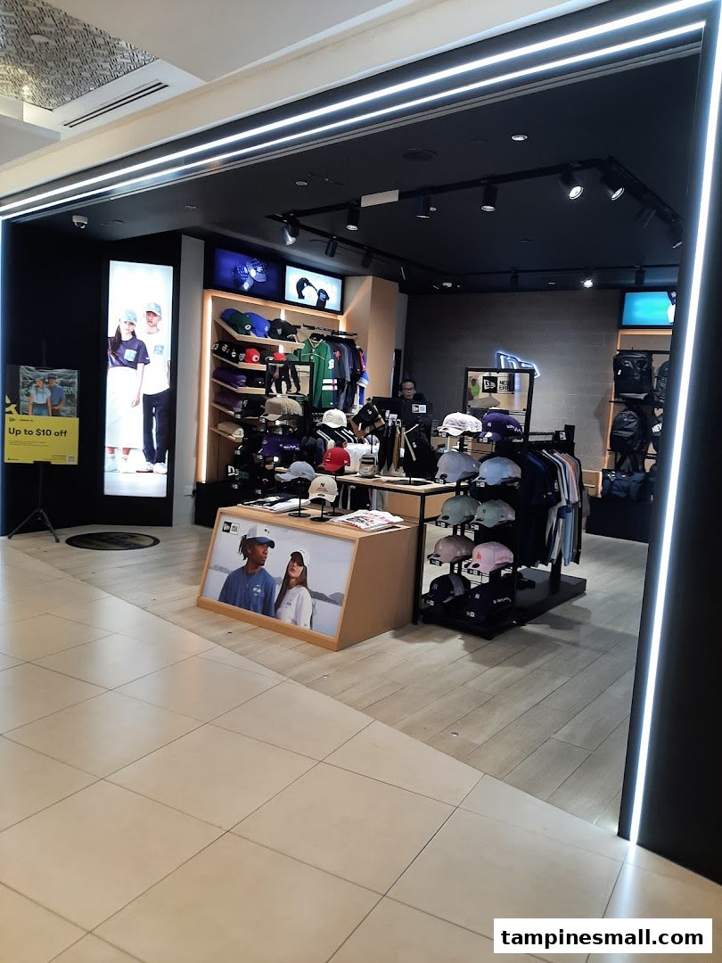 Brightly lit entrance of Weston Corp, a retail store showcasing hats, apparel, and accessories.