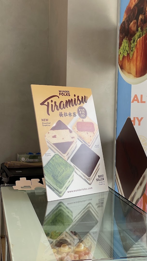 A display stand showcasing Wunderfolks' Tiramisu flavors and prices, including new and best-selling options.