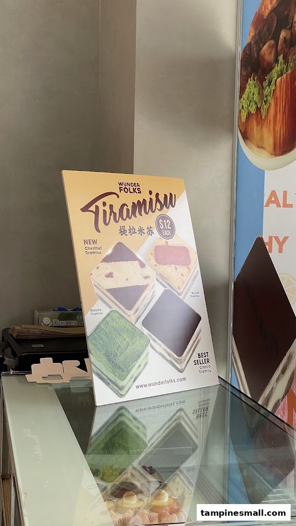 A display stand showcasing Wunderfolks' Tiramisu flavors and prices, including new and best-selling options.