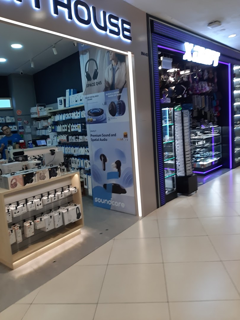 The illuminated entrance of X-Craft, a retail shop specializing in accessories and gadgets.