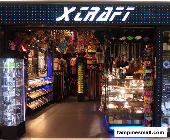 The X-Craft shop entrance, brightly lit, showcasing a wide array of accessories and unique items.