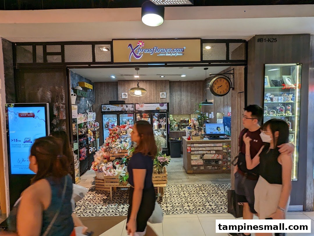 The image shows the inviting shopfront of Xpressflower, a vibrant floral and gift shop, with customers passing by.