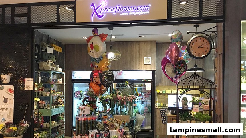 The Xpressflower shop front displays a vibrant array of fresh flowers, plants, and festive balloons.