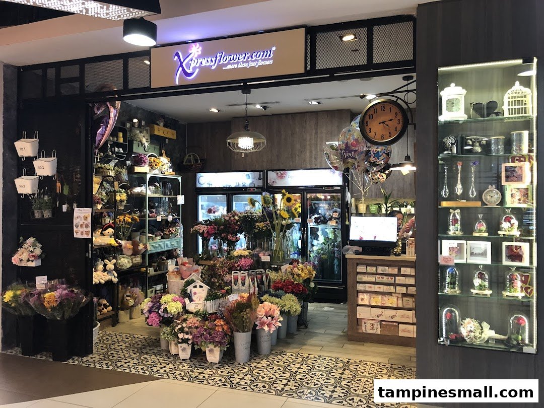 The vibrant entrance of Xpressflower, a floral shop, showcasing a wide array of flowers and gifts.