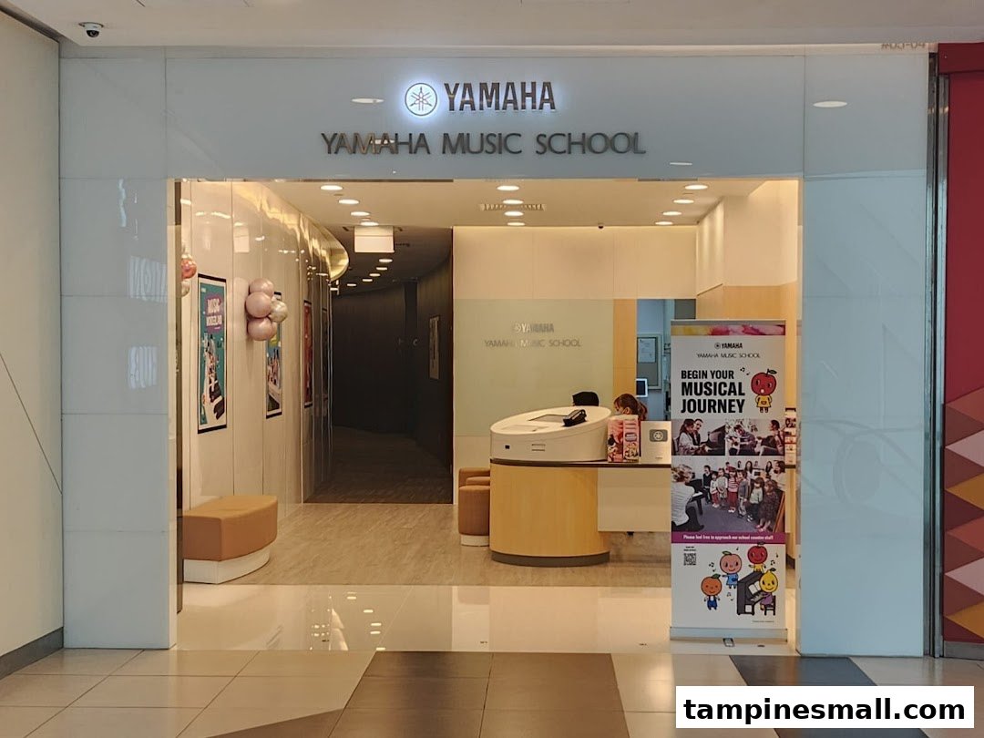 The inviting entrance of Yamaha Music School, featuring its logo, reception area, and a promotional banner.