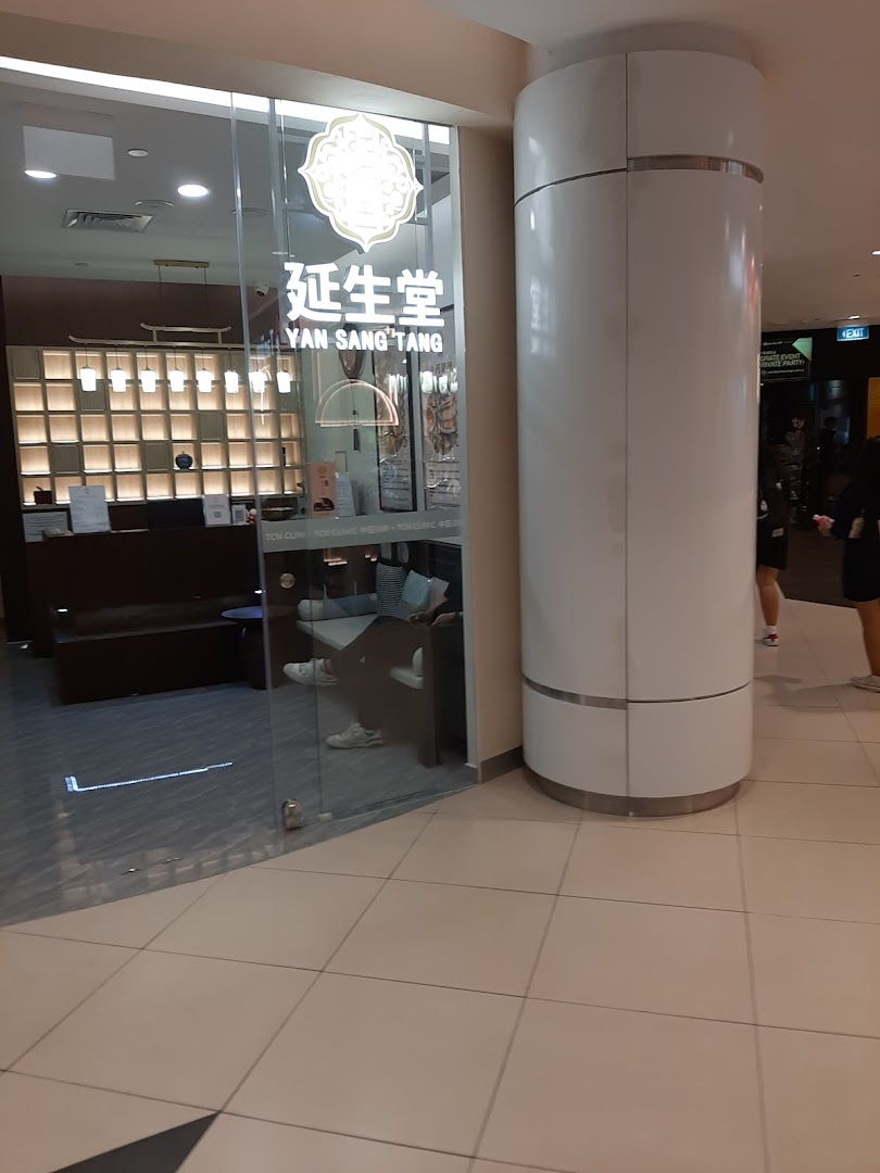 The glass entrance of Yan Sang Tang TCM Clinic, showcasing its logo and a glimpse of the inviting interior.