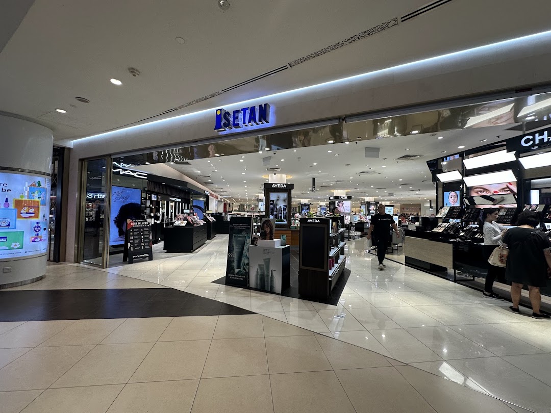 The inviting entrance of Isetan, showcasing a vibrant beauty and cosmetics department.