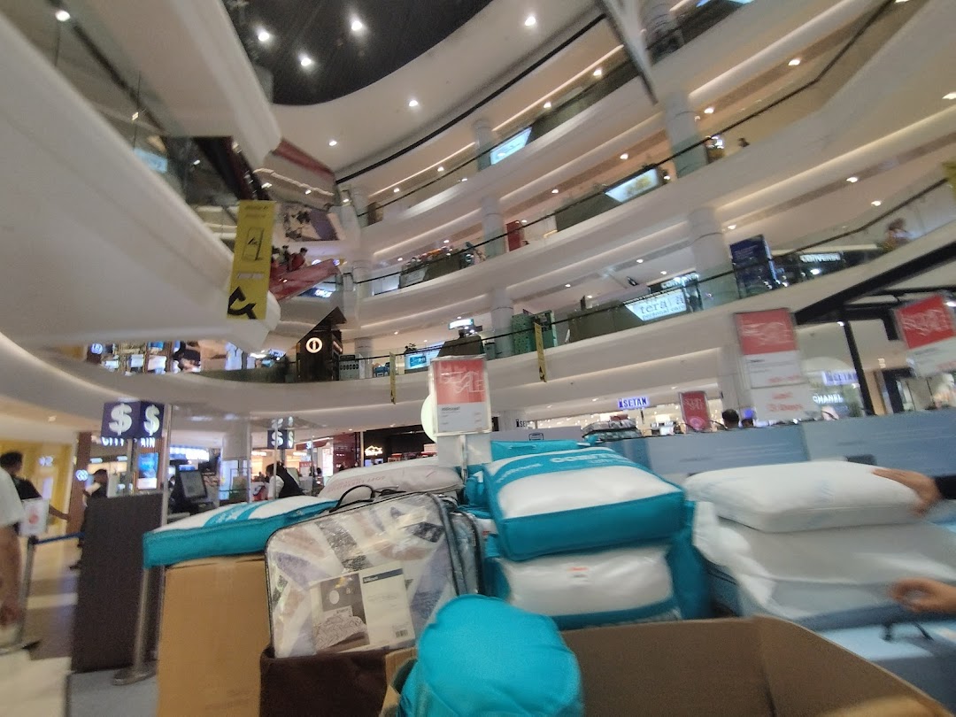 Interior view of Isetan Tampines, featuring a bedding display in a multi-level mall.
