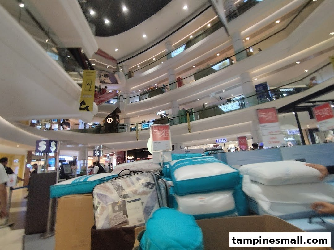 Interior view of Isetan Tampines, featuring a bedding display in a multi-level mall.