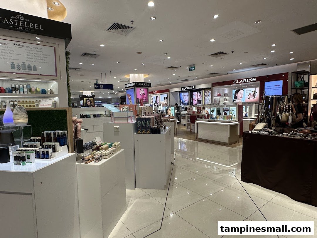 An interior view of a department store's beauty and wellness section featuring various cosmetic and skincare brands.