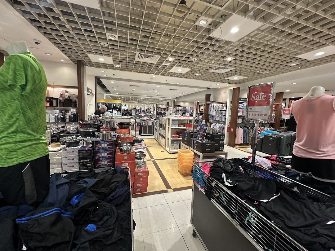 An interior view of Isetan, showcasing diverse departments including sportswear and kitchenware.