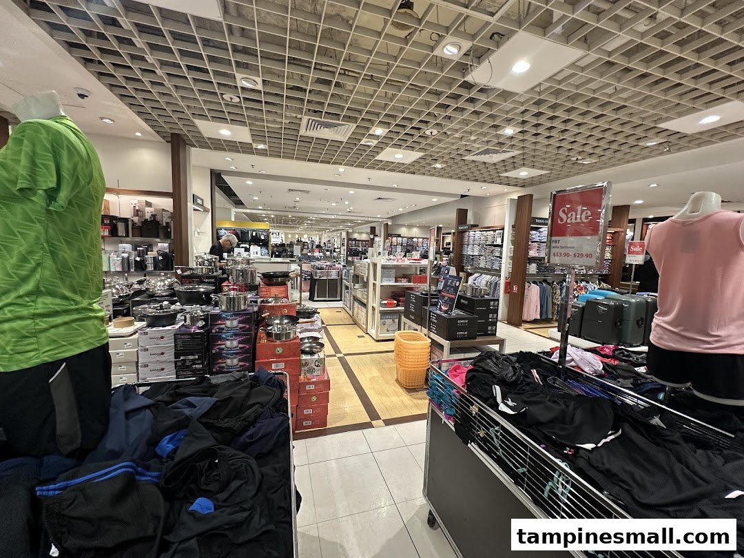An interior view of Isetan, showcasing diverse departments including sportswear and kitchenware.