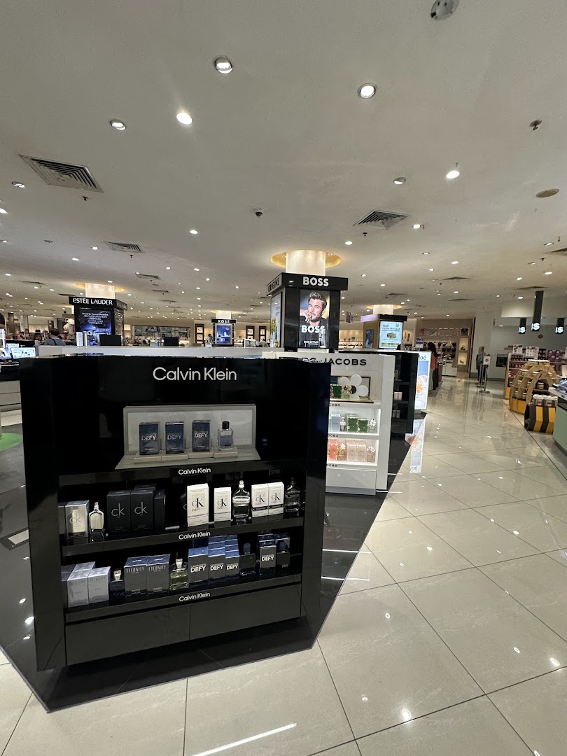 Interior view of Isetan's beauty department, showcasing Calvin Klein fragrances and other premium brands.