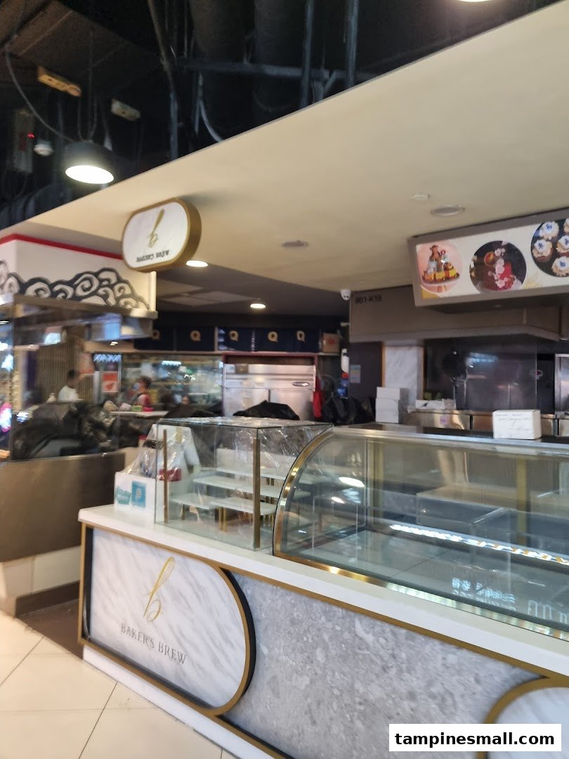Interior view of Baker's Brew counter with empty display cases and prominent branding.