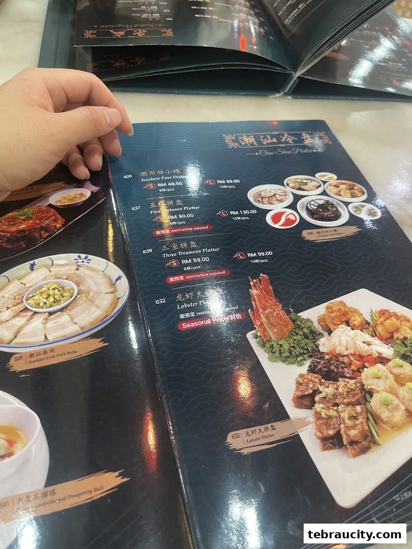 A close-up of a restaurant menu featuring various platters and dishes with prices.