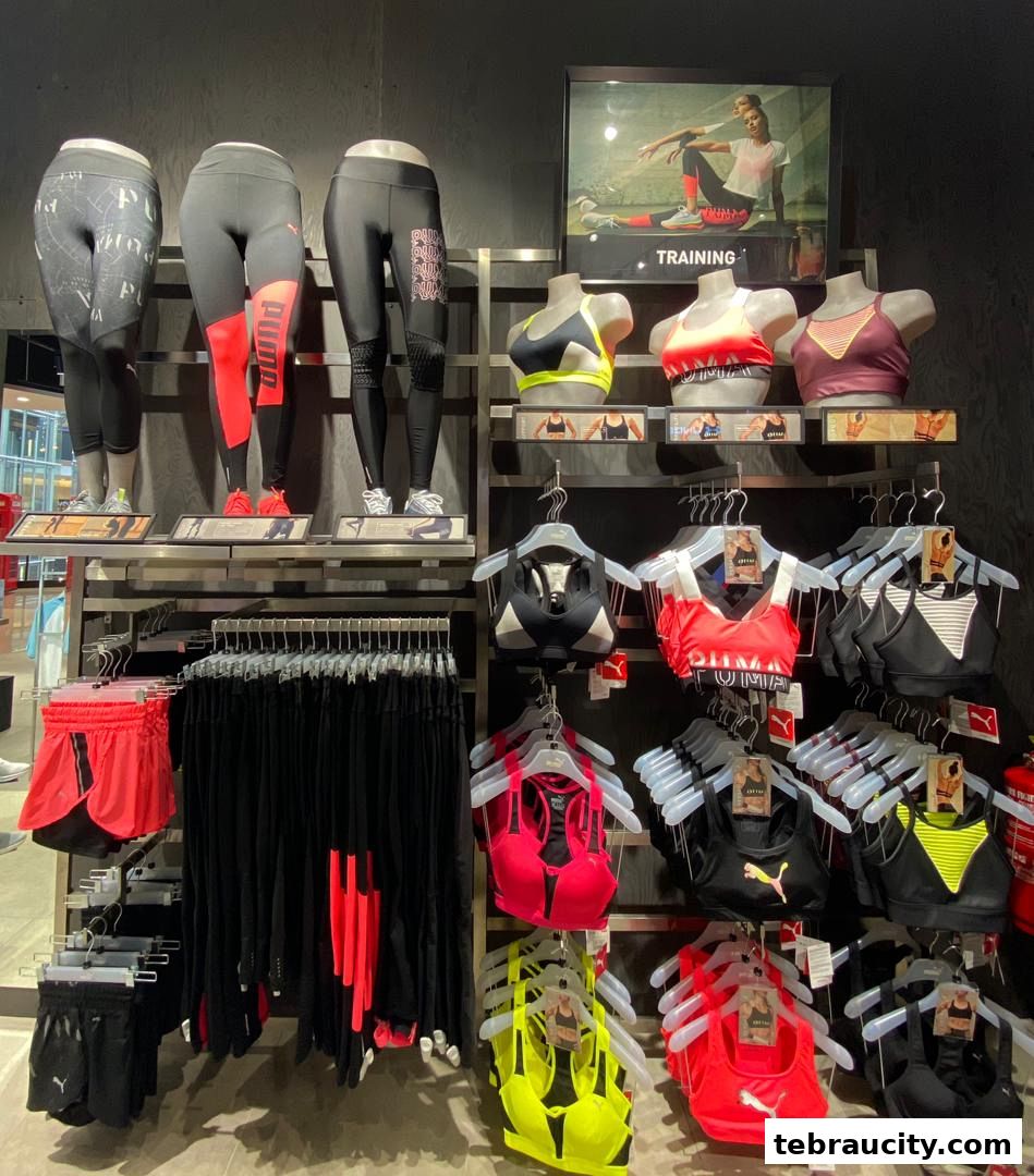 Puma store display featuring athletic wear, including leggings, sports bras, and shorts.