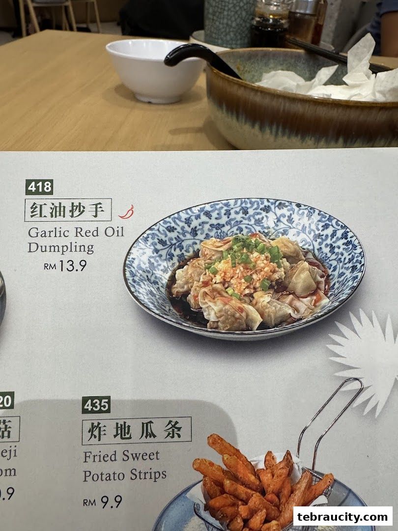 A menu featuring Garlic Red Oil Dumplings and Fried Sweet Potato Strips.