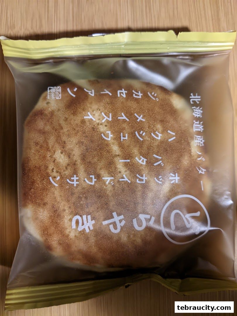 A packaged pancake with Japanese text indicating it's made with Hokkaido butter.