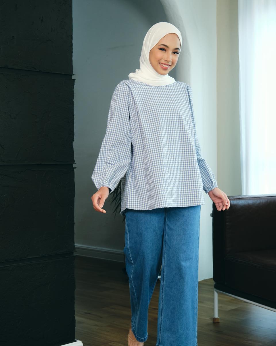 Elegant model showcasing a striped Poplook outfit