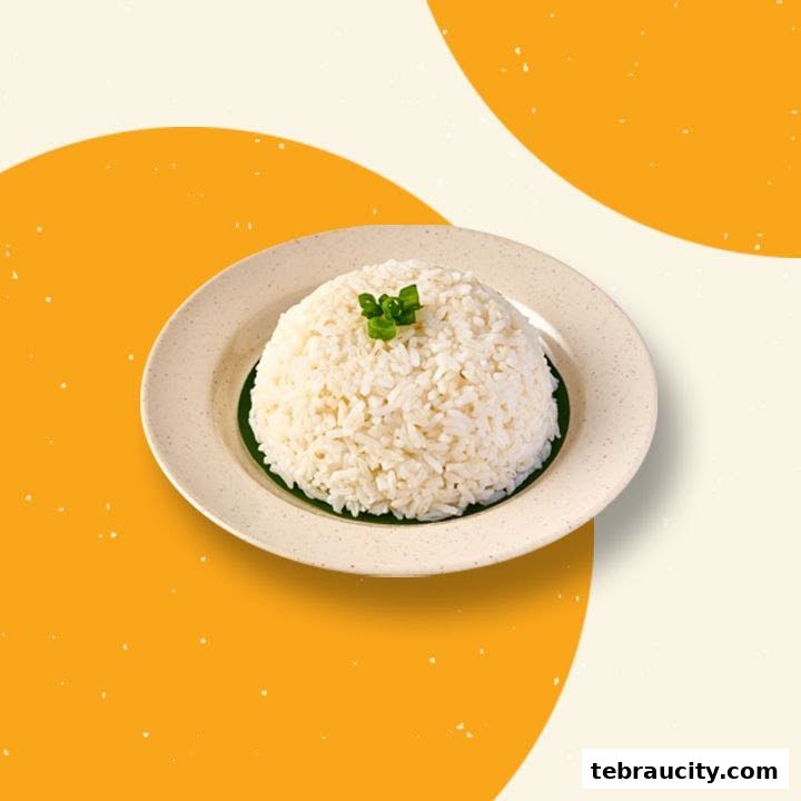 A plate of fluffy white rice topped with chopped green onions on a beige plate.