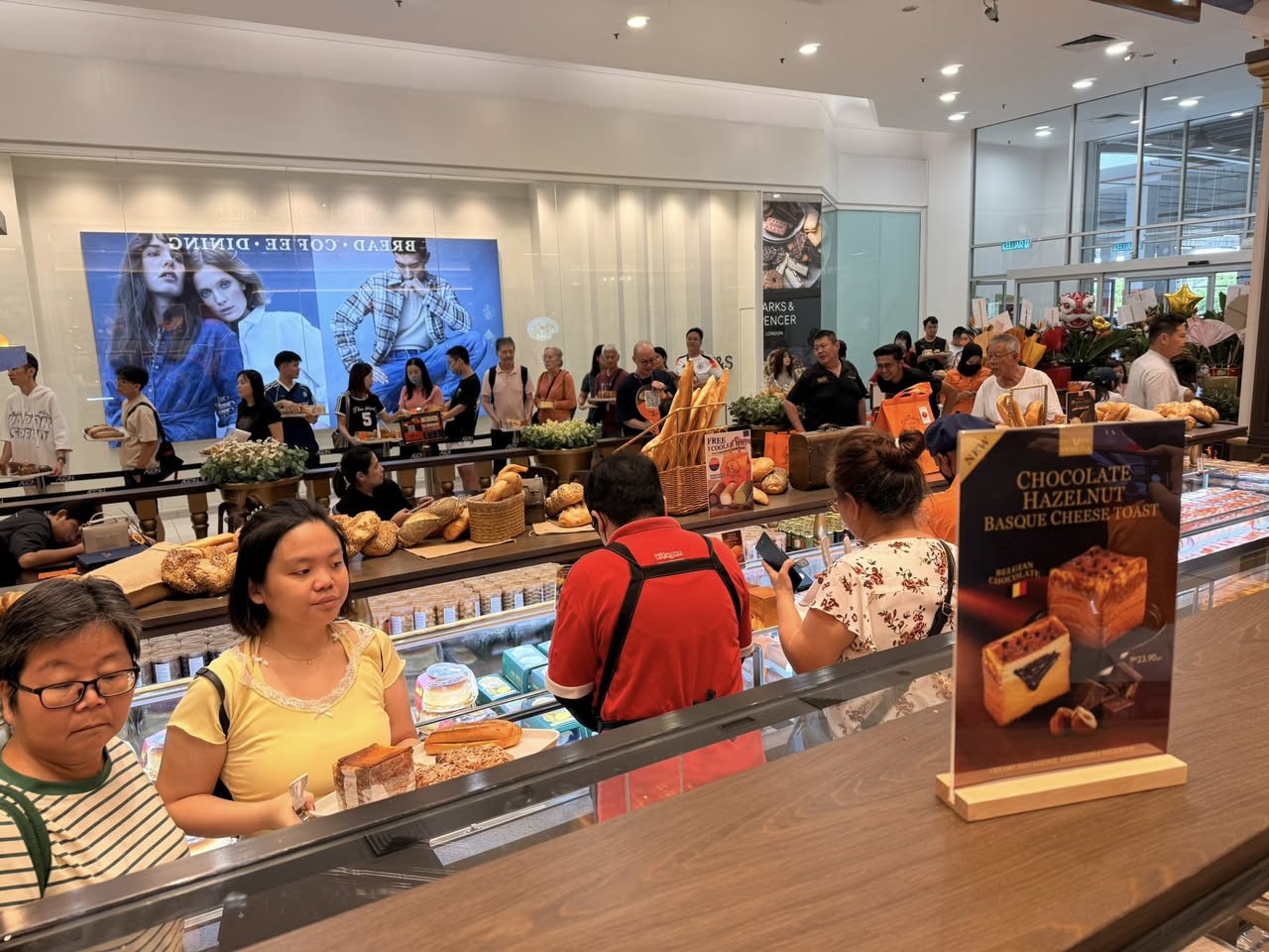 A close-up of exquisite croissants and baked goods on display