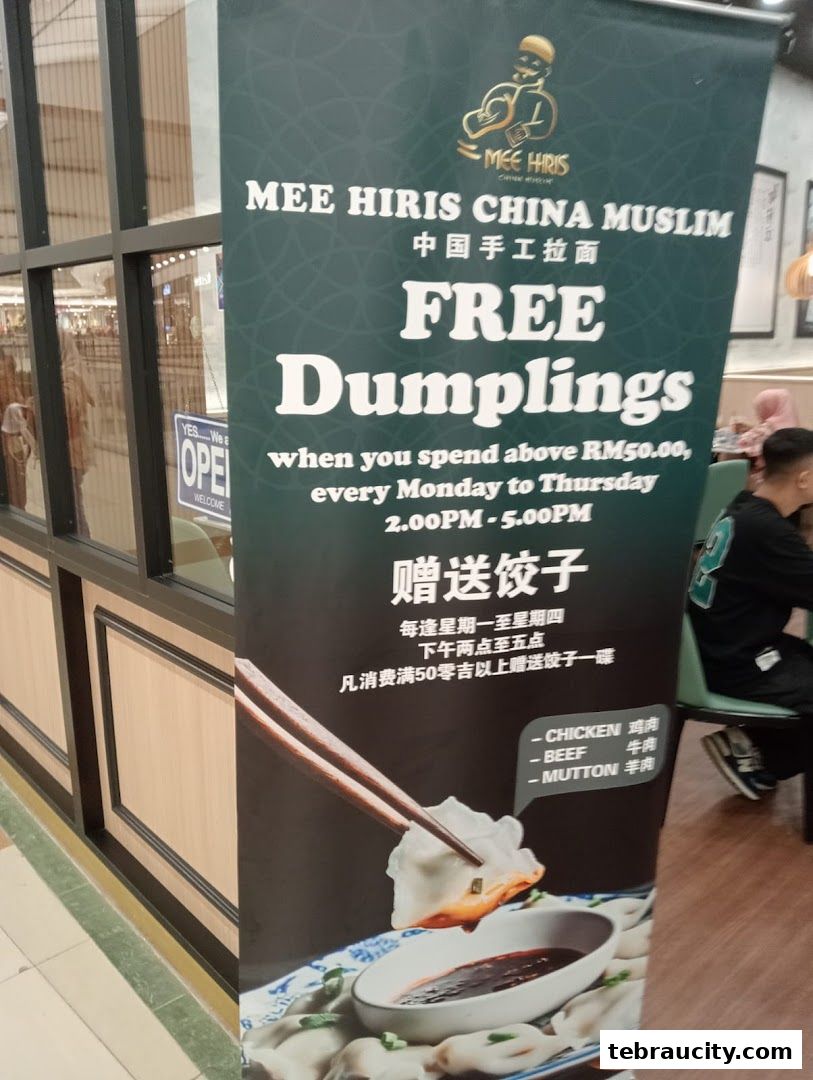 A promotional banner for Mee Hiris China Muslim offering free dumplings with a minimum spend.