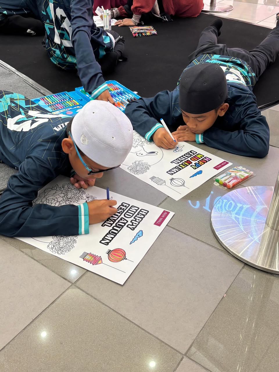 Participants enjoying the festive atmosphere of the coloring contest