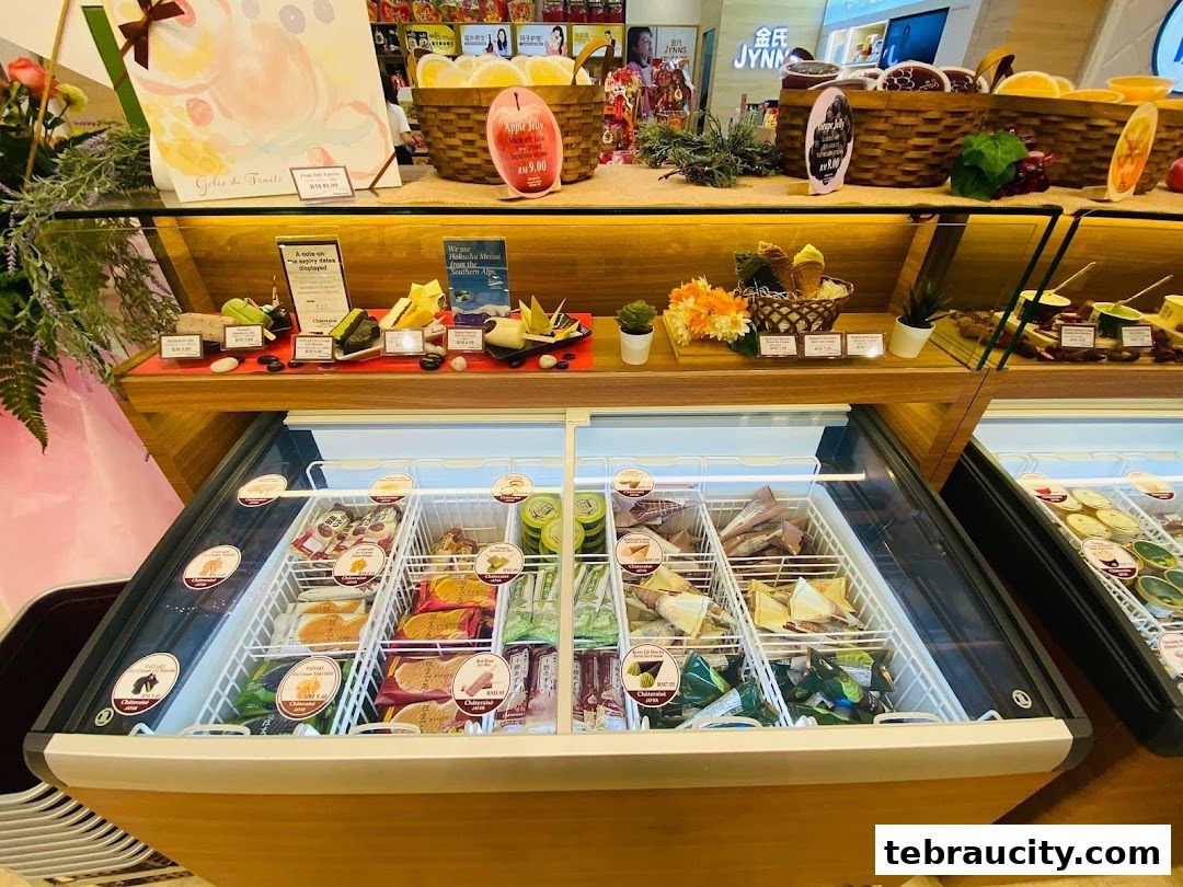 A display of assorted ice cream and desserts in a refrigerated case and on shelves.
