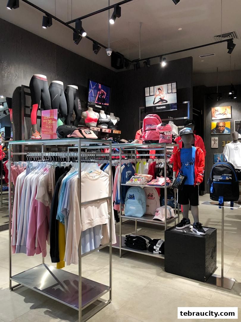 Interior view of a PUMA store showcasing athletic apparel, accessories, and mannequins.