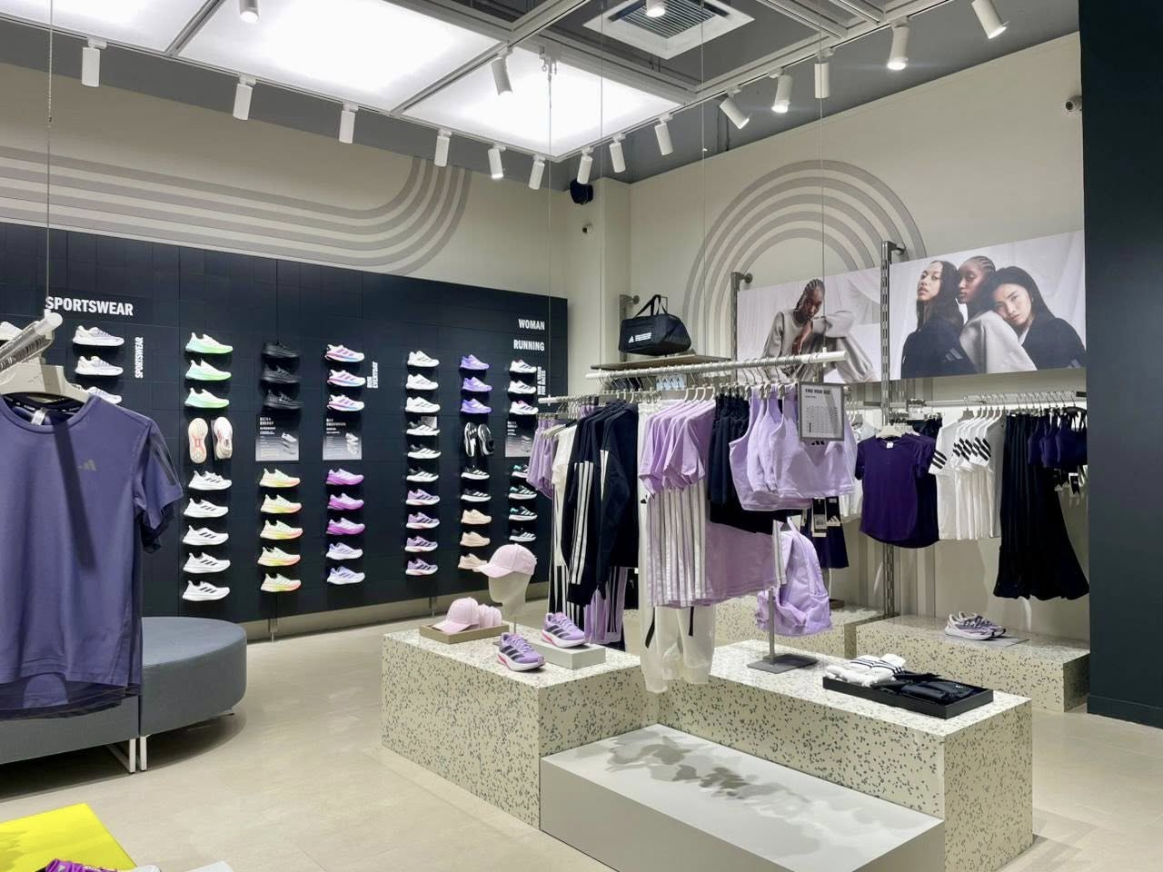 Interior view of the Adidas store with apparel displays and modern design