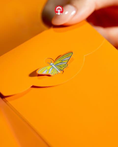 A close-up of the vibrant CHAGEE Yuzu Red Packets featuring intricate floral designs.