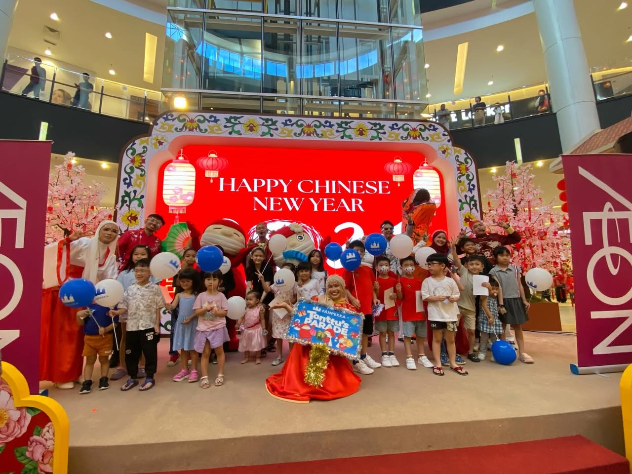 Colorful characters and performers interacting with the crowd