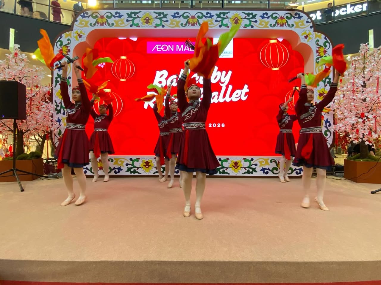 Dancers in a synchronized ensemble during a Ritzy Grace performance.