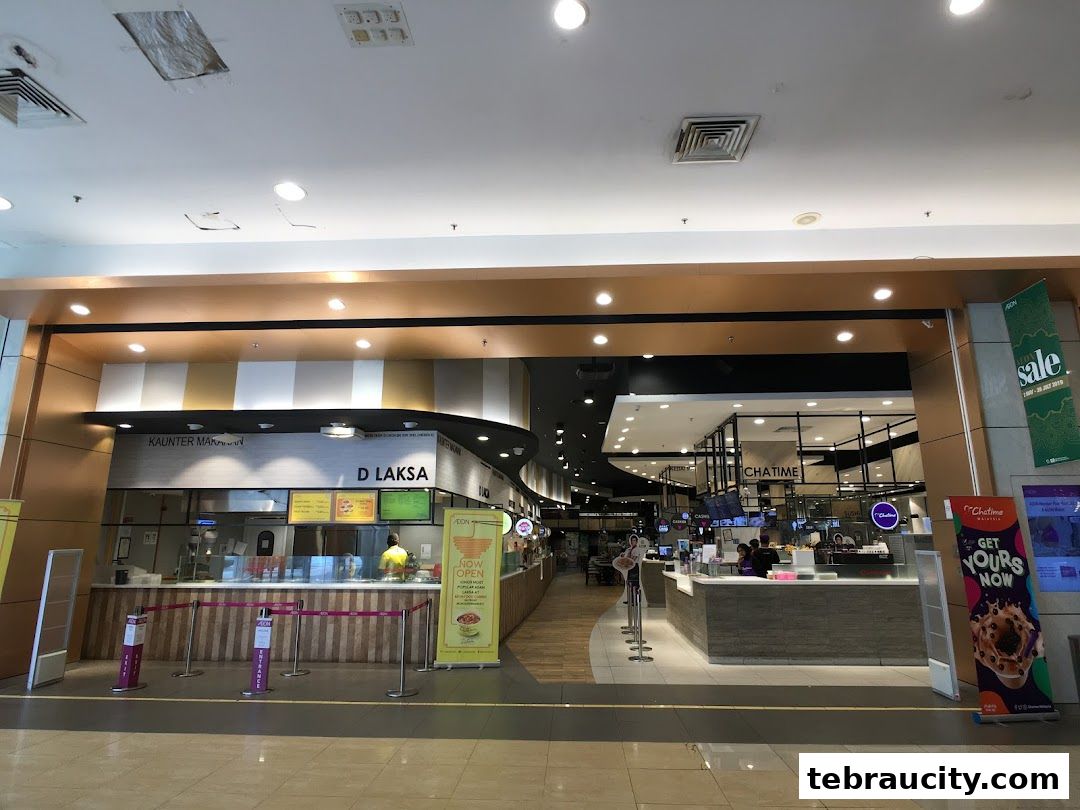 A view of the D Laksa food stall and Chatime bubble tea shop in a mall.