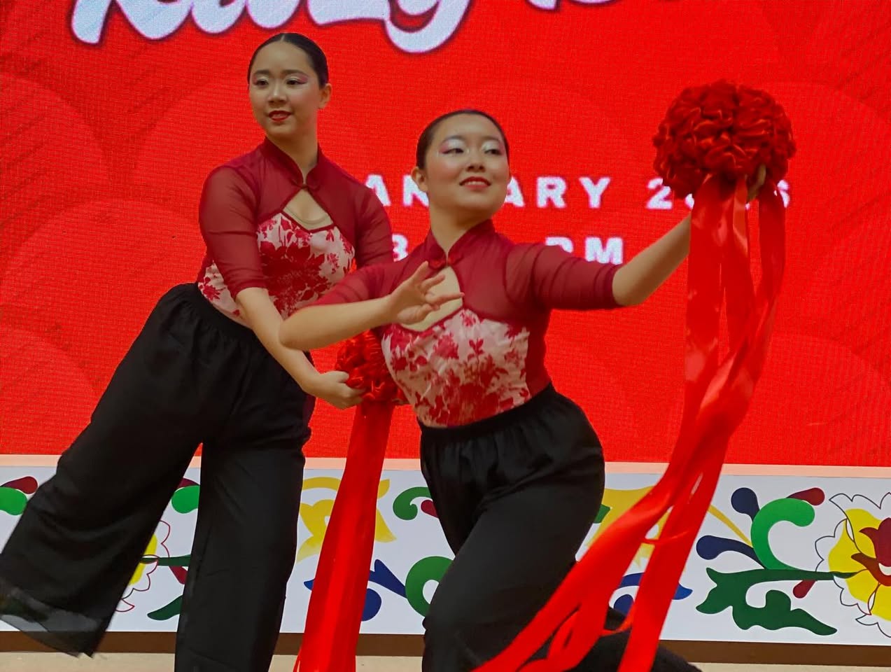 Dramatic stage lighting capturing the silhouette of a dancer.