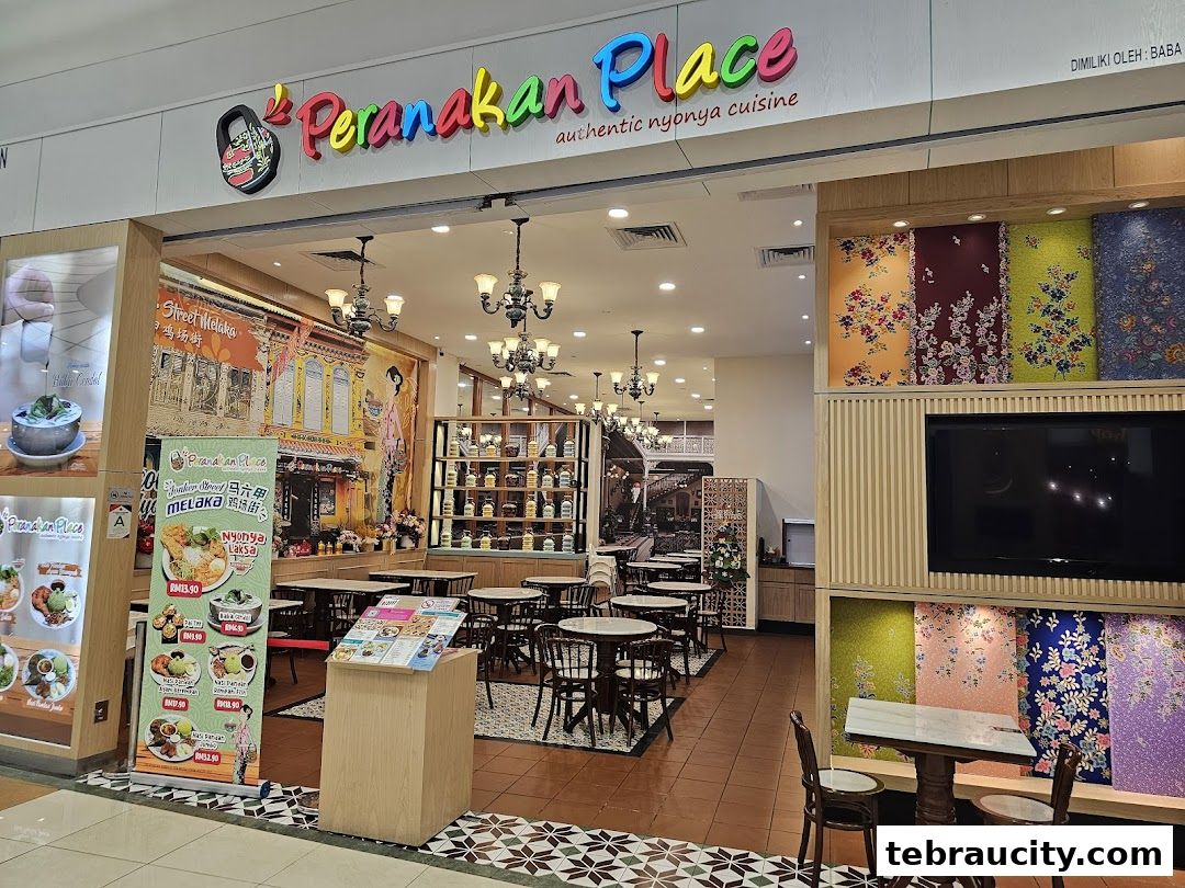 The entrance of Peranakan Place restaurant, featuring colorful decor and seating.