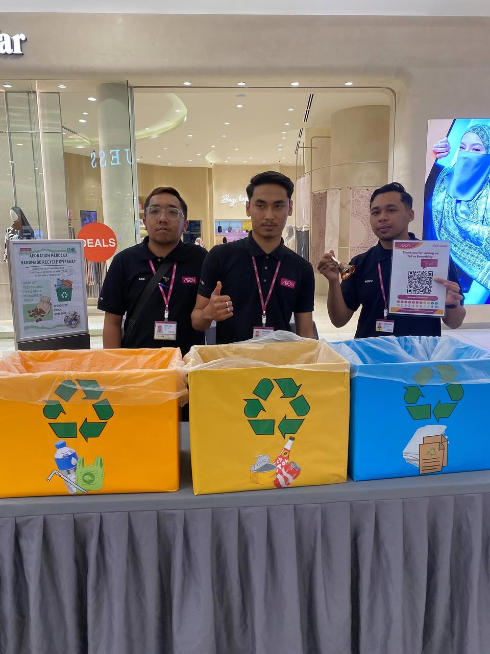 Community members engaging in sustainable activities at AEON Mall Tebrau City