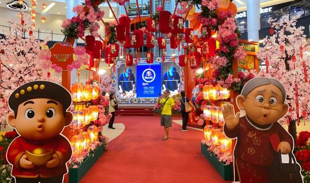 Festive Chinese New Year decorations and floral displays at AEON MALL