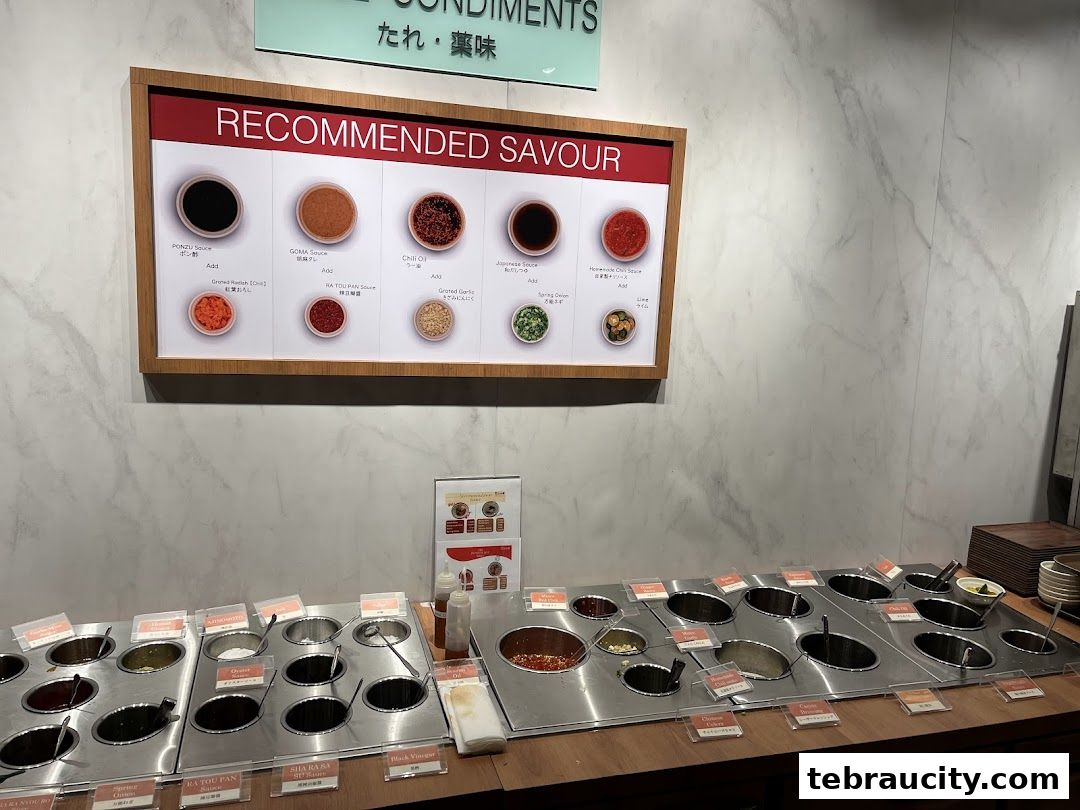 A display of various sauces and condiments for hot pot dining.