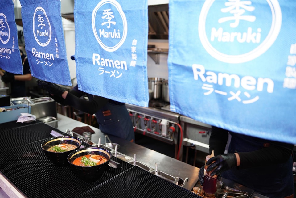 A close-up shot of Maruki Ramen's perfectly cooked noodles and expertly arranged ingredients.