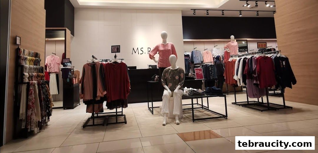 Interior view of a clothing store with mannequins and racks of women's apparel.