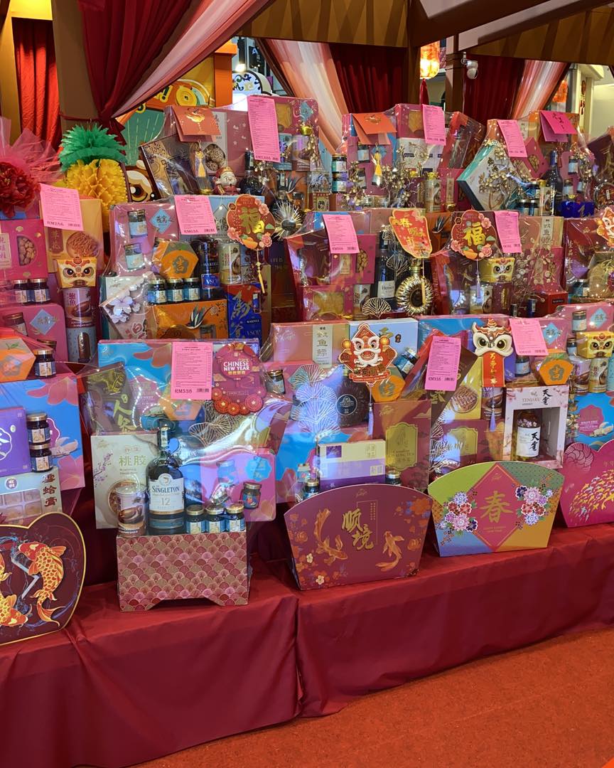 Close-up of festive gift sets featuring traditional Lunar New Year decorations