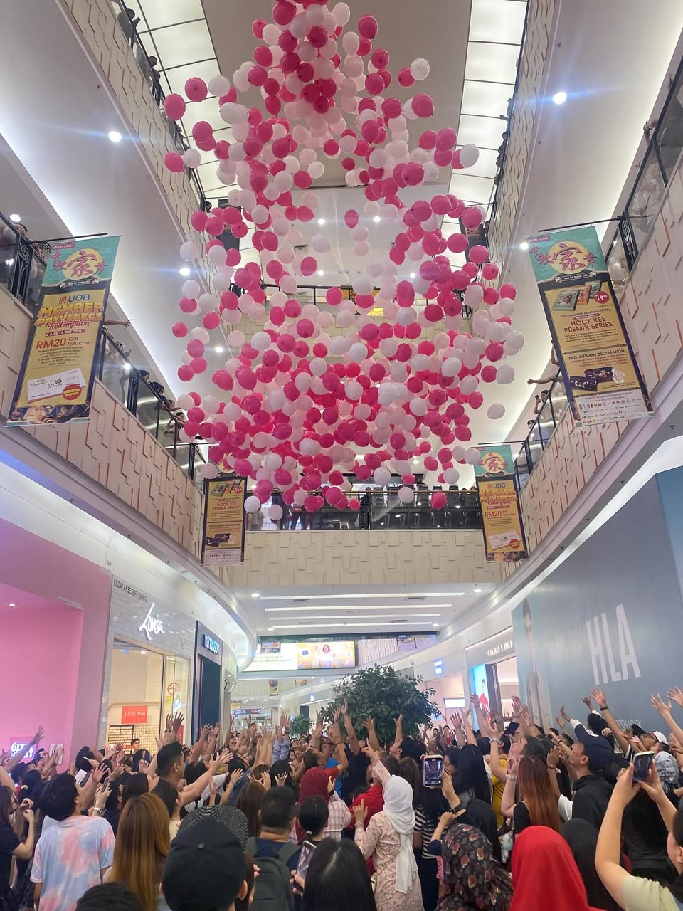 Families and children enjoying the festive atmosphere of the balloon drop