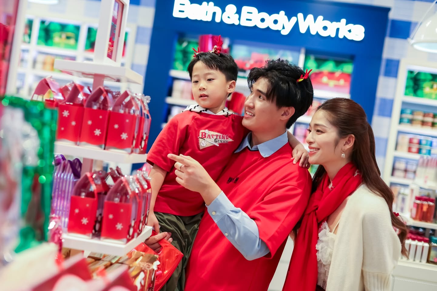 Joyful shoppers experiencing Christmas wonder at AEON MALL