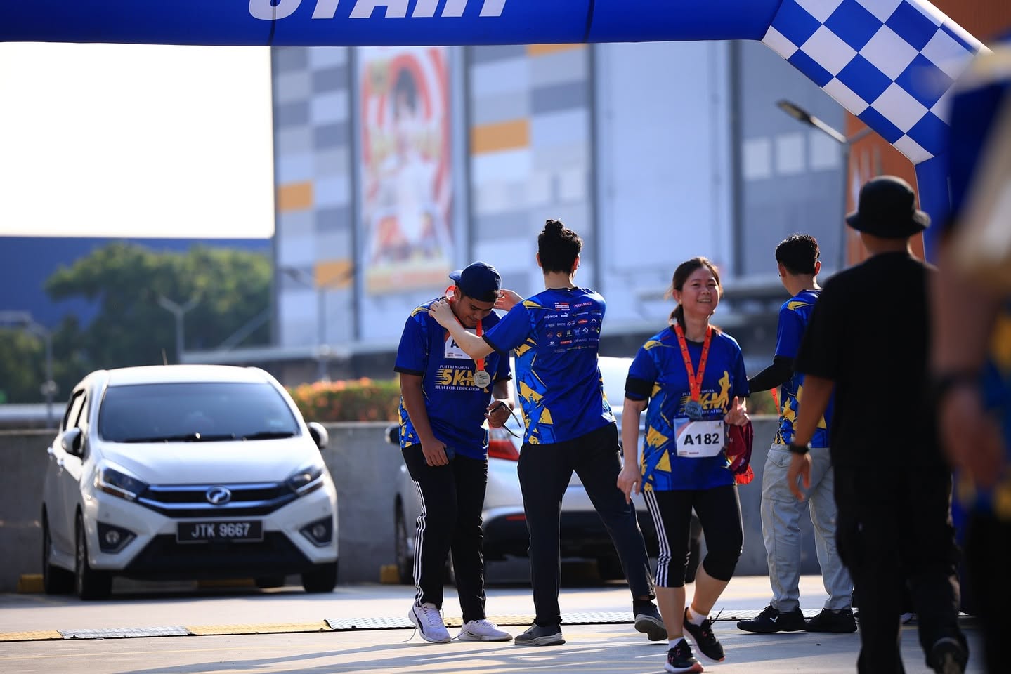 Participants smiling during the Run for Education event